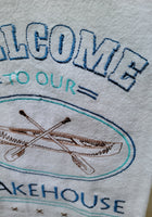 "Welcome to our Lakehouse"  Towel